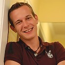 Tommy plays with himself on the bed.